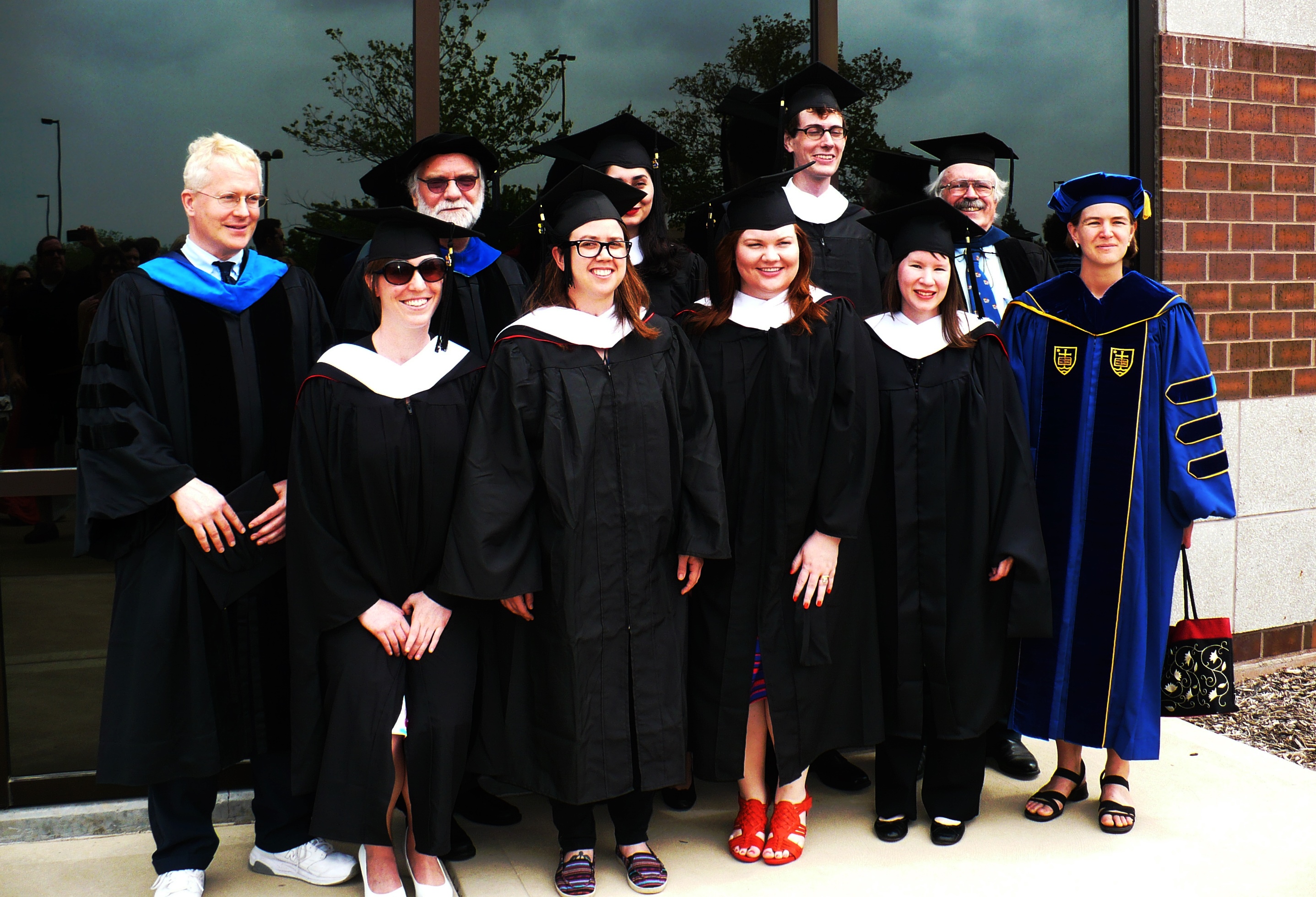 Photograph of Religious Studies graduates and faculty members in caps and gowns.